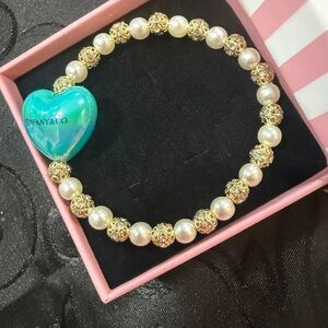 Elegant Gold and Pearl Bracelet with Turquoise Heart Charm